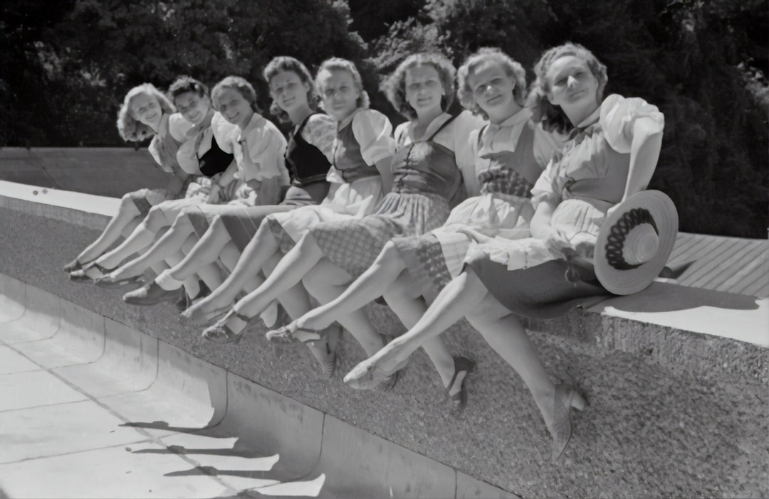 Salzburg Festival 1946 by Camping Checklist grayscale photo of group of women sitting on concrete bench